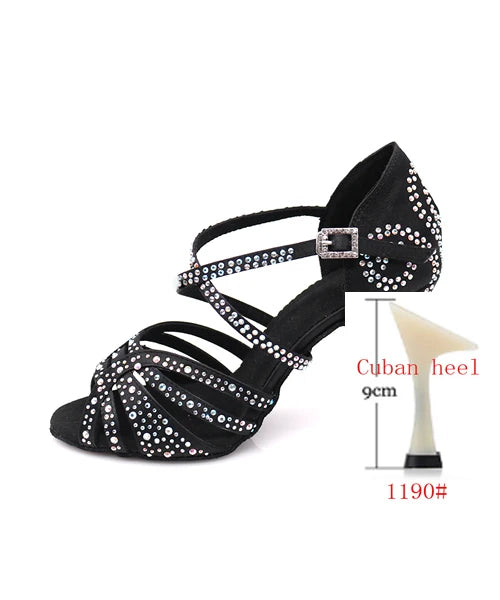 Black sandal with rhinestone details and a Cuban heel on a white background